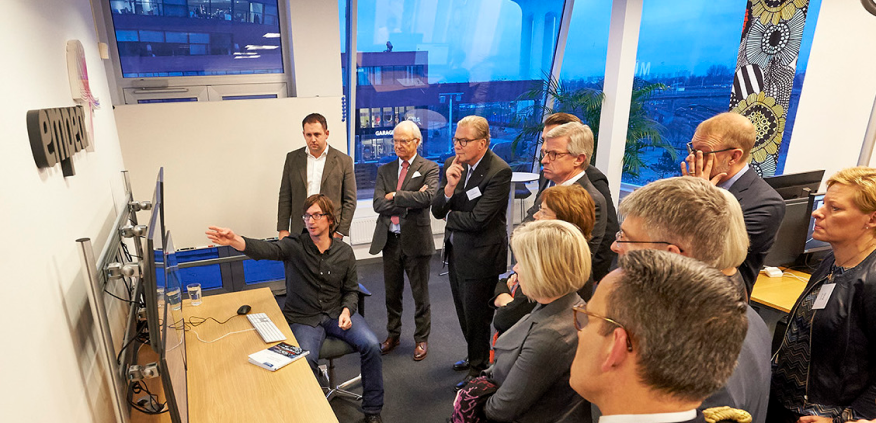 Adam Tornhill presents CodeScene for the Swedish king Carl XVI Gustaf (standing, second from the left).